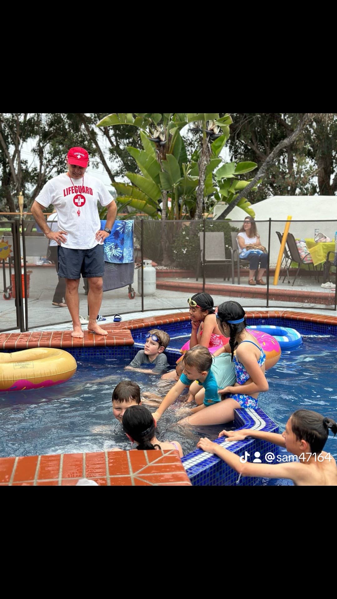 ATLAS coach leading a children's swim lesson