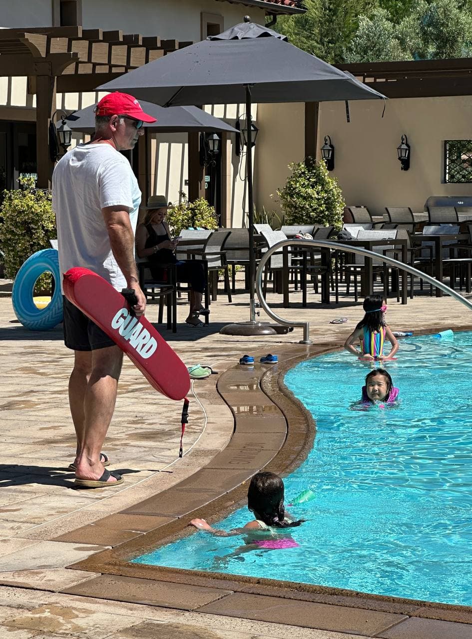 ATLAS lifeguard coach supervising children in a pool