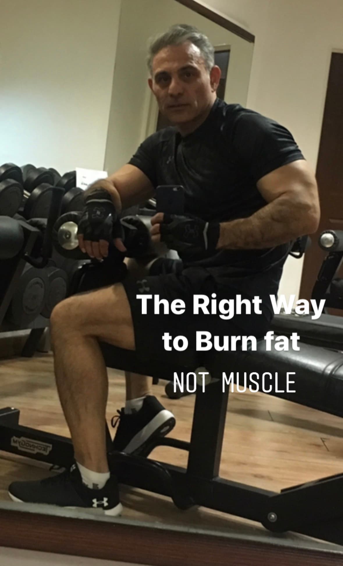 ATLAS strength coach performing cable curls in the gym